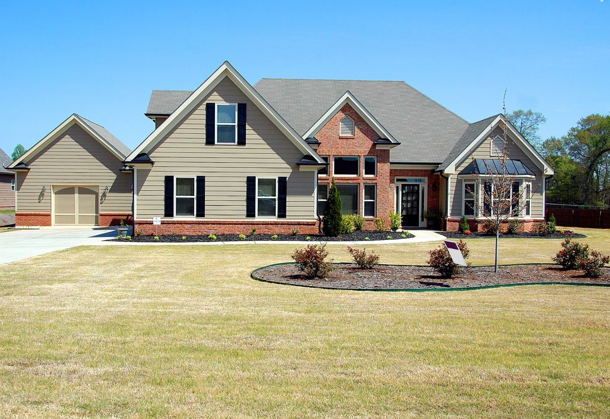 Home with fresh mulch beds and improved curb appeal