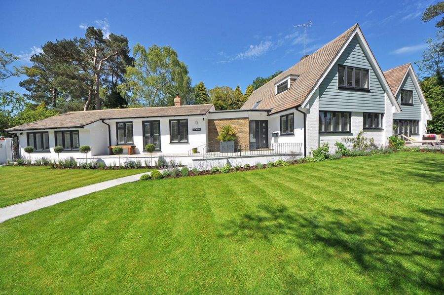 Residential property with a striped, well-kept lawn